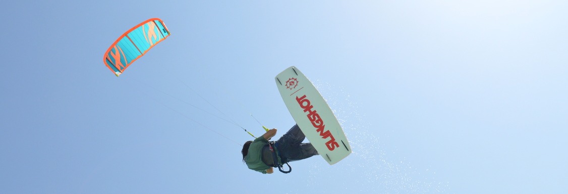 Why is windsurfing in El Gouna one of the most exciting water sports enjoyed by millions of people around the world?